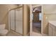 Bathroom boasts glass-enclosed shower and commode at 580 Camry Cir, Dallas, GA 30157