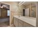 Bathroom featuring large vanity, framed mirror and a view into the primary bedroom and the glass door shower at 580 Camry Cir, Dallas, GA 30157