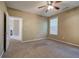 Bedroom with neutral color palette, carpet and a ceiling fan at 580 Camry Cir, Dallas, GA 30157