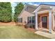 Home featuring well-manicured front lawn, brick entryway and mature landscaping at 580 Camry Cir, Dallas, GA 30157