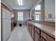 Community kitchen featuring long countertop, cherry wood cabinets, an oven, and a refrigerator at 580 Camry Cir, Dallas, GA 30157