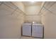 Convenient laundry room with washer and dryer hookups and wire shelving for storage at 580 Camry Cir, Dallas, GA 30157