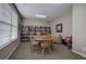 Inviting library room with bookshelves, a round table, chairs and natural light from a bright window at 580 Camry Cir, Dallas, GA 30157