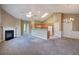 Spacious living room with fireplace, ceiling fan, and open access to kitchen with breakfast bar at 580 Camry Cir, Dallas, GA 30157