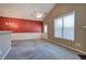 Living room with fireplace, ceiling fan, window, and entry door with sidelight at 580 Camry Cir, Dallas, GA 30157