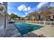 Community pool closed for the season with cover on and featuring white fencing and several neighborhood homes at 580 Camry Cir, Dallas, GA 30157