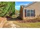 Side yard featuring mature trees and neutral siding at 580 Camry Cir, Dallas, GA 30157