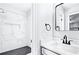Stylish bathroom showcasing a tiled shower with niche and black and white modern accents at 800 Post Road Cir, Stone Mountain, GA 30088