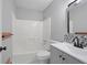 Clean bathroom with shower and tub, updated vanity and tile backsplash at 800 Post Road Cir, Stone Mountain, GA 30088