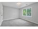 Bedroom features carpet and good light from the window at 800 Post Road Cir, Stone Mountain, GA 30088