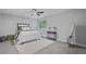 Bright bedroom features carpet, a ceiling fan, and window to exterior at 800 Post Road Cir, Stone Mountain, GA 30088