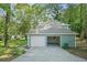 Exterior shot of home featuring garage, driveway, and yard at 800 Post Road Cir, Stone Mountain, GA 30088