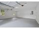 Spacious three car garage with neutral walls, ceiling, and flooring at 800 Post Road Cir, Stone Mountain, GA 30088