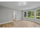 Sunny room with large windows, a door, and light-colored floors at 800 Post Road Cir, Stone Mountain, GA 30088