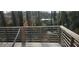 An image of a wooden back deck with metal railings overlooking a wooded, backyard space at 1301 Lavista Ne Rd, Atlanta, GA 30324