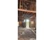 An interior view of a house under construction, showing exposed wood framing, unfinished floors, and natural light at 1301 Lavista Ne Rd, Atlanta, GA 30324