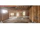 Image showcases the exposed framing and rough-in stage of a large living room remodel in a home at 1301 Lavista Ne Rd, Atlanta, GA 30324