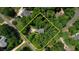 An aerial view of the property, surrounded by lush trees and landscaping at 2165 Robin Hood Trl, Cumming, GA 30040