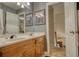 Well-lit bathroom with double sink vanity, framed mirrors, and a clean, modern design at 2165 Robin Hood Trl, Cumming, GA 30040