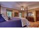 Serene primary bedroom with a plush bed, stylish decor, and generous natural light for a peaceful ambiance at 2165 Robin Hood Trl, Cumming, GA 30040