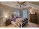 Inviting bedroom with sloped ceilings, a plush bed, and a cozy atmosphere at 2165 Robin Hood Trl, Cumming, GA 30040