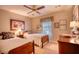 Comfortable bedroom with twin beds, neutral walls, and plenty of natural light from the window at 2165 Robin Hood Trl, Cumming, GA 30040