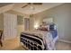 Warm bedroom showcasing a comfortable bed, neutral tones, and ample closet space at 2165 Robin Hood Trl, Cumming, GA 30040