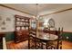 An elegant dining room with a classic hutch, hardwood floors, and traditional decor for formal entertaining at 2165 Robin Hood Trl, Cumming, GA 30040