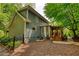 View of the exterior featuring a screened in porch and an attractive yard at 2165 Robin Hood Trl, Cumming, GA 30040
