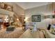 Spacious living room with an open floor plan, staircase, and ample seating at 2165 Robin Hood Trl, Cumming, GA 30040