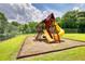 Playground with slides, climbing structure, and tire swing for community fun at 2165 Robin Hood Trl, Cumming, GA 30040
