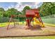 Community playground featuring swings, slides, and climbing structure for outdoor fun at 2165 Robin Hood Trl, Cumming, GA 30040