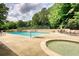 Enjoy the community pool and hot tub with ample seating for relaxation at 2165 Robin Hood Trl, Cumming, GA 30040