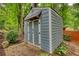 Organize your yard with this well-maintained, siding shed and patio area at 2165 Robin Hood Trl, Cumming, GA 30040