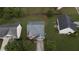 Overhead shot of a home with an attached garage, surrounded by a green lawn and other neighborhood homes at 3292 Shady Valley Ct, Loganville, GA 30052