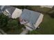 Aerial view of a house with a garage, driveway, and trees at 3292 Shady Valley Ct, Loganville, GA 30052