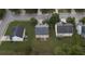 Aerial view of a house in a neighborhood with green lawns and tree-lined streets, showcasing the roof at 3292 Shady Valley Ct, Loganville, GA 30052