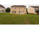 Exterior rear of the home highlighting yard with grass at 3292 Shady Valley Ct, Loganville, GA 30052