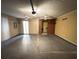 Spacious garage featuring ceiling fans, electrical panel, and ample room for storage and vehicles at 3292 Shady Valley Ct, Loganville, GA 30052