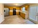 Well-lit kitchen featuring stainless steel appliances, wood cabinets, and an adjacent door to the outside at 3292 Shady Valley Ct, Loganville, GA 30052