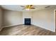 Cozy living room with a corner fireplace, neutral color scheme, new floors and plenty of natural light at 3292 Shady Valley Ct, Loganville, GA 30052
