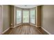 Sunlit living area with large bay windows providing ample natural light and attractive flooring at 3292 Shady Valley Ct, Loganville, GA 30052
