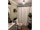 Cozy bathroom with modern fixtures, decorative shower curtain, and stylish storage solutions at 40 Legend Creek, Douglasville, GA 30134