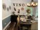 Stylish dining room featuring elegant decor, a rustic table and wine-themed accents at 40 Legend Creek, Douglasville, GA 30134