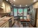 Bright kitchen with stainless appliances, light cabinets, granite counters, and a cozy breakfast nook at 40 Legend Creek, Douglasville, GA 30134