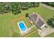 Aerial image of backyard with pool, deck, landscaping, and view of the surrounding acreage at 161 Honey Creek Rd, Mcdonough, GA 30252