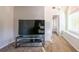Bedroom featuring carpet, a large TV, and a view into the main bathroom at 161 Honey Creek Rd, Mcdonough, GA 30252