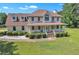 Inviting two-story home featuring a large front porch and well-manicured landscaping at 161 Honey Creek Rd, Mcdonough, GA 30252
