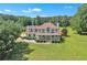 Charming two-story house with a covered porch and lush greenery in a serene setting at 161 Honey Creek Rd, Mcdonough, GA 30252