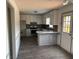 Kitchen with granite countertops, stainless steel appliances, white cabinets, and wood look floors at 161 Honey Creek Rd, Mcdonough, GA 30252